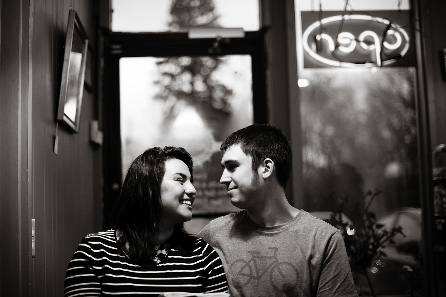 an engaged couple in a cafe