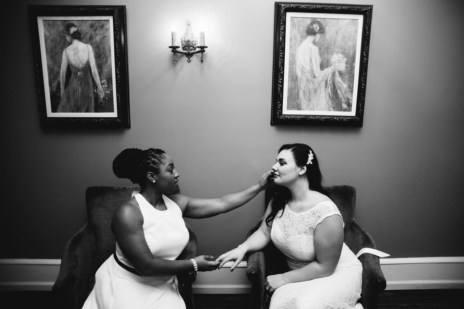 two brides holding hands