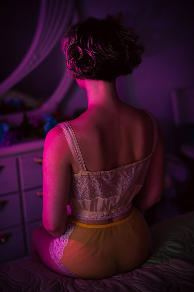 a girls back i pink light
