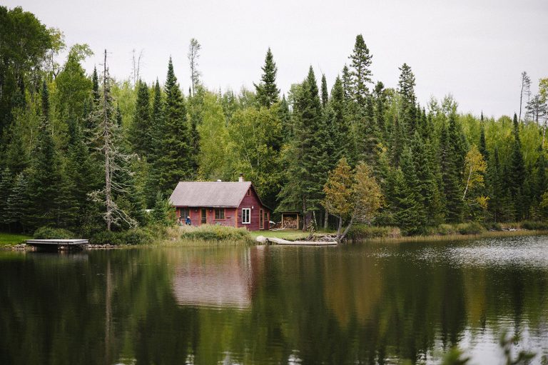 dark red cabin on a lake near the North Shore of Minnesota