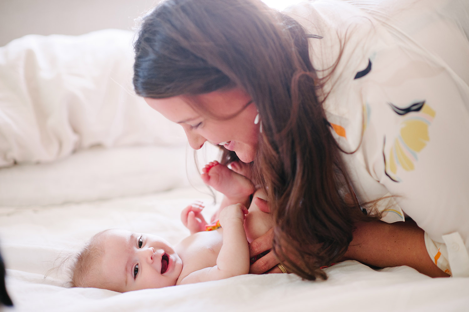 a woman cuddling with her baby