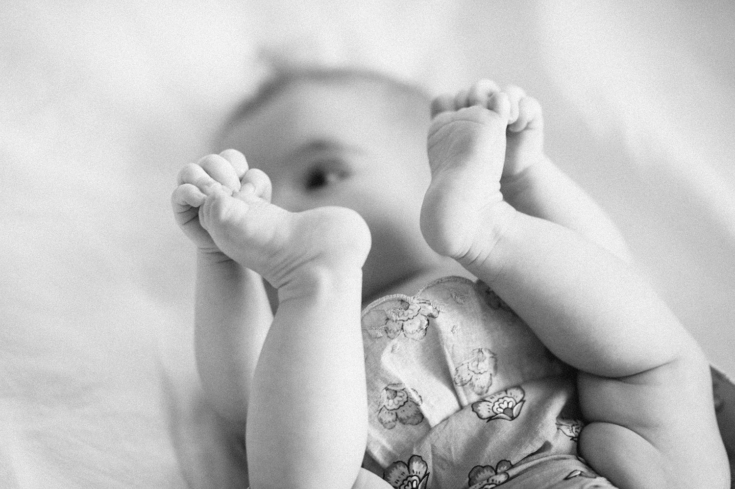 black and white photo of babies feet