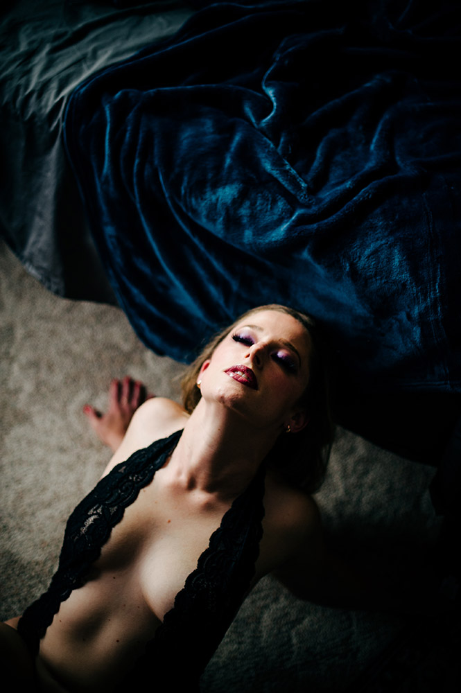blond woman in boudoir black lace