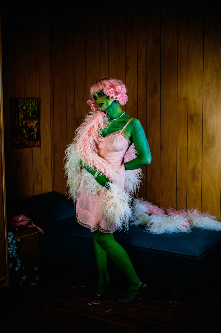 a green zombie girl with pink hair pink nightie and pink boa at Grandpas pool house