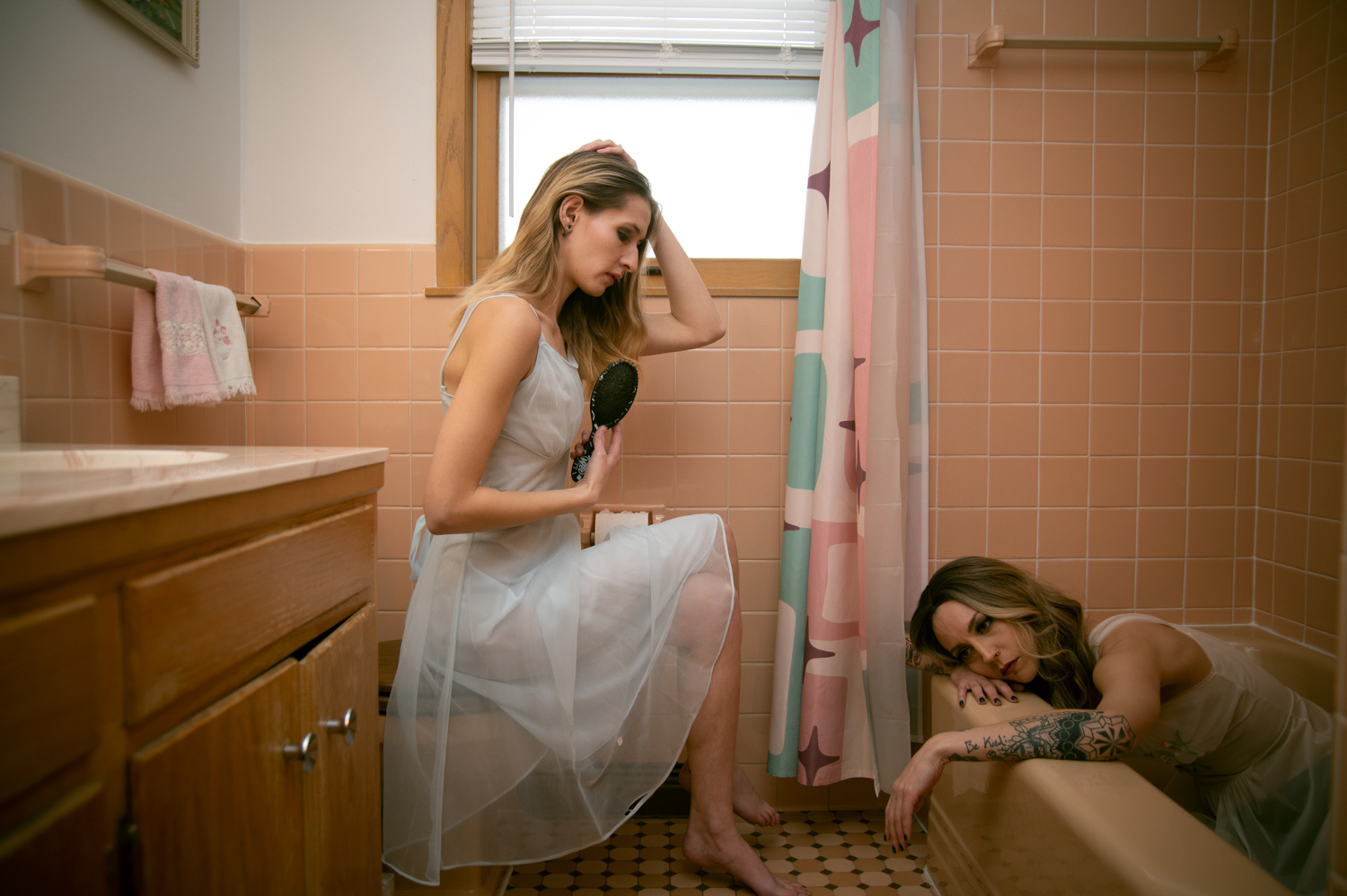 two lonely girls in nighties in bathroom